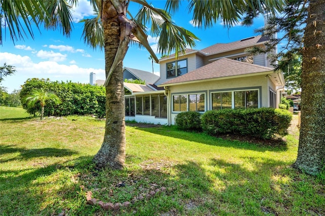738 Powderhorn Cir, Lake Mary, FL 32746 - exterior space featuring a yard, stucco siding, a sunroom, and roof with shingles