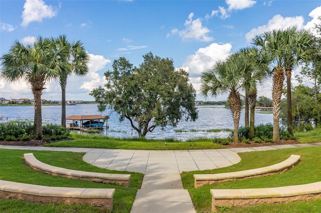 7837 Bostonian Dr, Winter Garden, FL 34787 - surrounding community with a lawn, a water view, and a dock