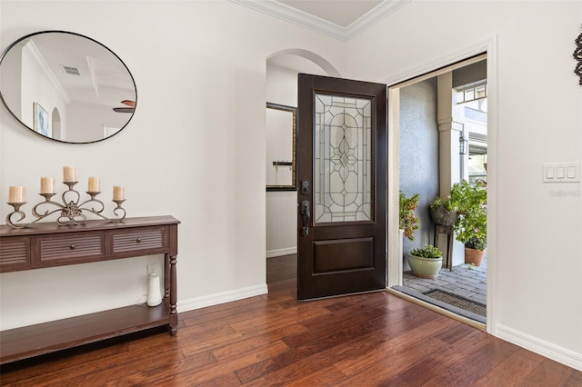 7837 Bostonian Dr, Winter Garden, FL 34787 - entryway featuring crown molding, baseboards, dark wood-style floors, and visible vents