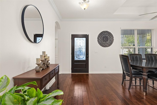 7837 Bostonian Dr, Winter Garden, FL 34787 - entryway featuring arched walkways, ornamental molding, baseboards, and dark wood-type flooring