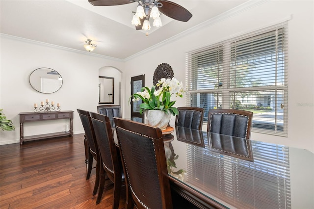 7837 Bostonian Dr, Winter Garden, FL 34787 - dining space with crown molding, wood finished floors, baseboards, ceiling fan, and arched walkways