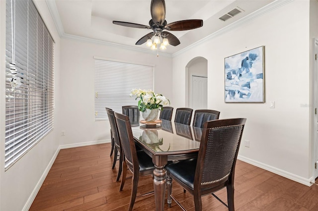 7837 Bostonian Dr, Winter Garden, FL 34787 - dining space featuring visible vents, wood-type flooring, baseboards, ceiling fan, and arched walkways