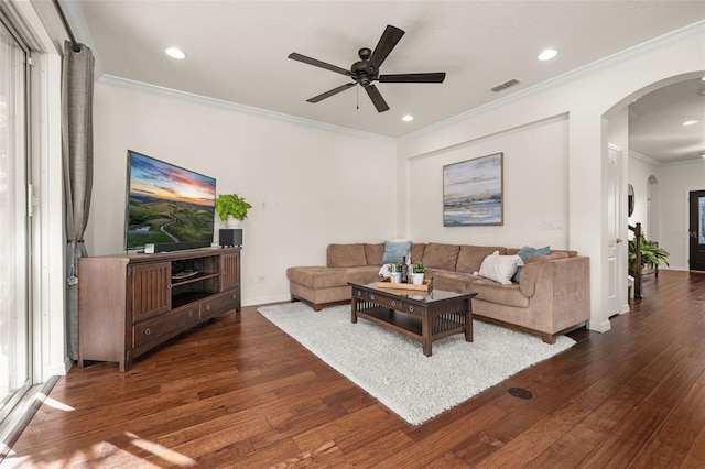 7837 Bostonian Dr, Winter Garden, FL 34787 - living area featuring a ceiling fan, visible vents, arched walkways, hardwood / wood-style flooring, and ornamental molding