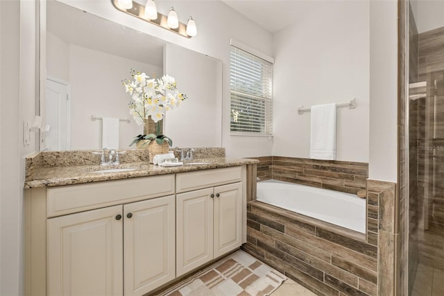 7837 Bostonian Dr, Winter Garden, FL 34787 - full bathroom featuring a sink, a bath, a tile shower, and double vanity