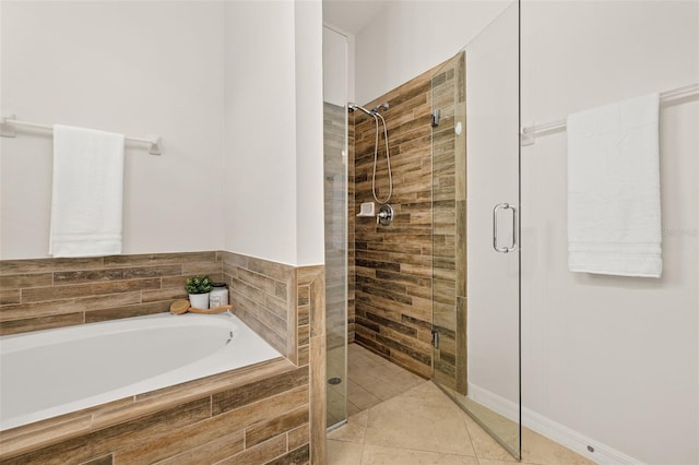 7837 Bostonian Dr, Winter Garden, FL 34787 - bathroom with tile patterned flooring, a bath, and a shower stall