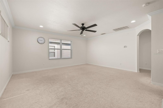 7837 Bostonian Dr, Winter Garden, FL 34787 - unfurnished room featuring crown molding, arched walkways, light carpet, and visible vents