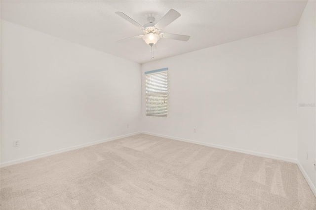 7837 Bostonian Dr, Winter Garden, FL 34787 - unfurnished room with baseboards, a ceiling fan, and light colored carpet