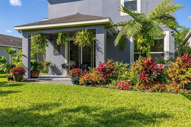 7837 Bostonian Dr, Winter Garden, FL 34787 - back of house with stucco siding and a yard