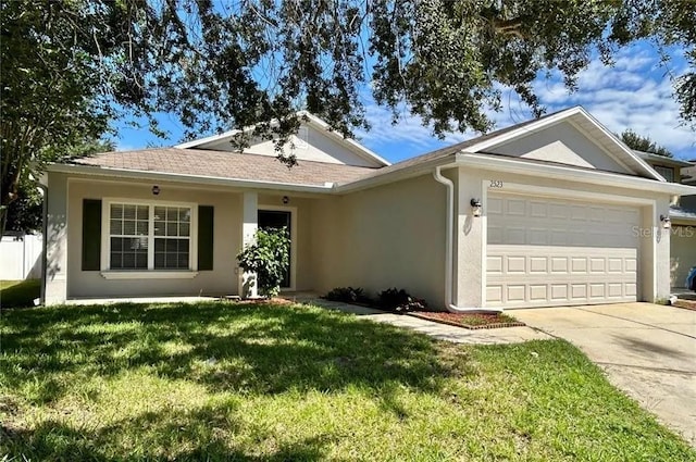 ranch-style house featuring concrete driveway, stucco siding, an attached garage, and a front lawn