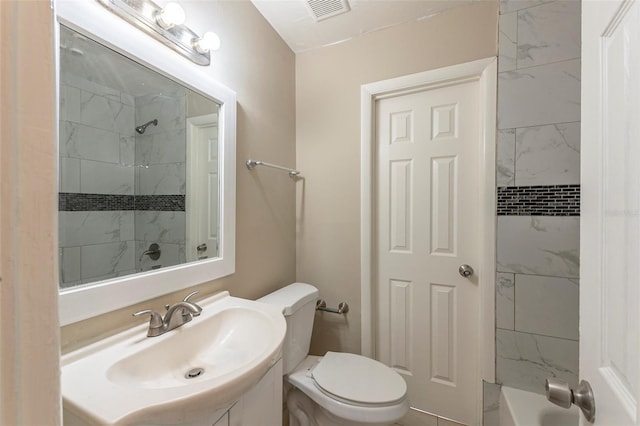 bathroom with visible vents, toilet, vanity, and  shower combination