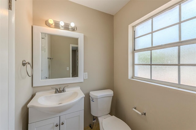 bathroom featuring toilet and vanity