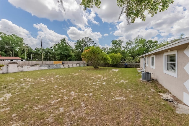 view of yard with cooling unit and a fenced backyard