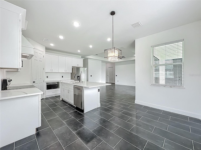 kitchen with visible vents, light countertops, a notable chandelier, and stainless steel appliances