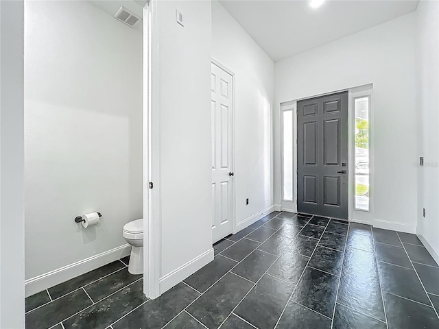 entryway with visible vents and baseboards