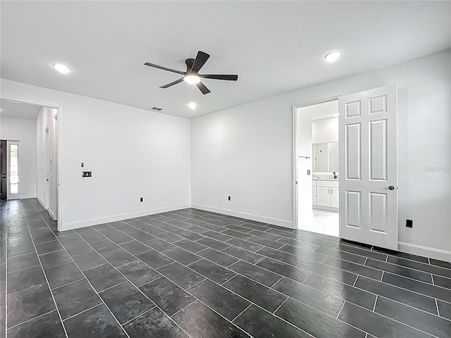 unfurnished room with visible vents, baseboards, dark tile patterned floors, a ceiling fan, and recessed lighting