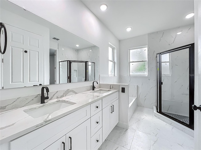 bathroom featuring visible vents, marble finish floor, a sink, and a marble finish shower