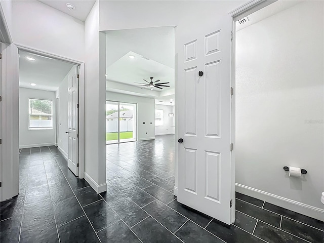 hallway featuring baseboards
