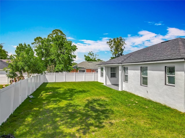 view of yard featuring a fenced backyard