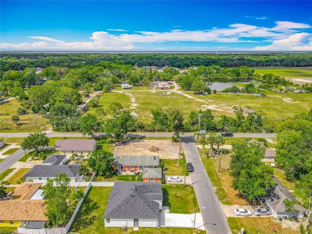 birds eye view of property with a residential view and a water view
