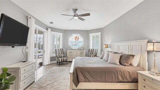 bedroom with access to outside, a ceiling fan, visible vents, light tile patterned flooring, and baseboards
