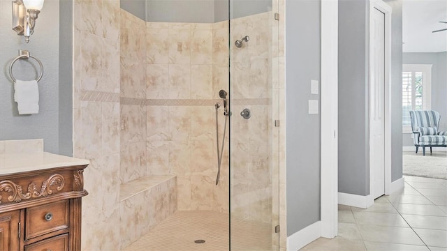 full bath with a shower stall, tile patterned floors, and vanity