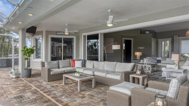 view of patio featuring an outdoor living space and a ceiling fan