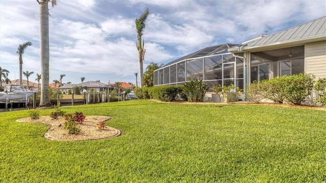 view of yard featuring glass enclosure