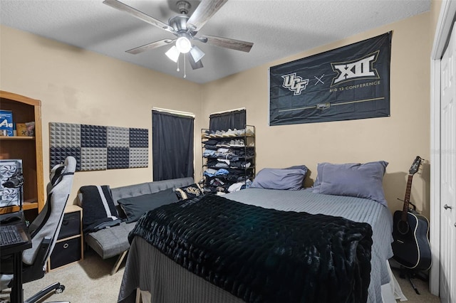 carpeted bedroom with a ceiling fan