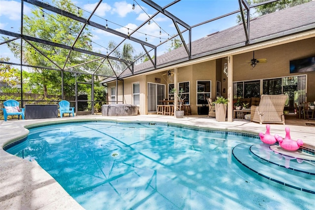 view of swimming pool featuring a ceiling fan, a fenced in pool, a patio, and a lanai