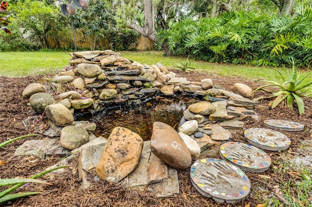 exterior details featuring a small pond