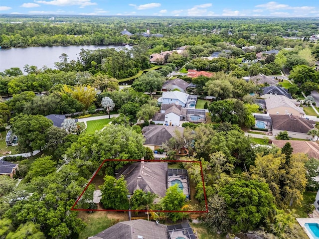 drone / aerial view with a water view and a residential view
