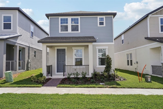 16484 Silver Brook Way, Winter Garden, FL 34787 - view of front of house with covered porch, roof with shingles, a front yard, and central AC