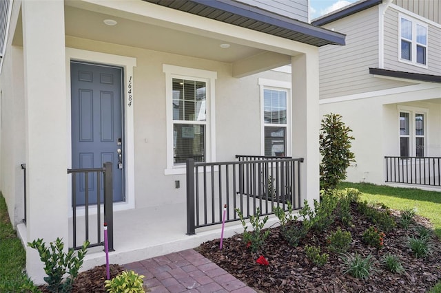 16484 Silver Brook Way, Winter Garden, FL 34787 - view of exterior entry with covered porch and stucco siding