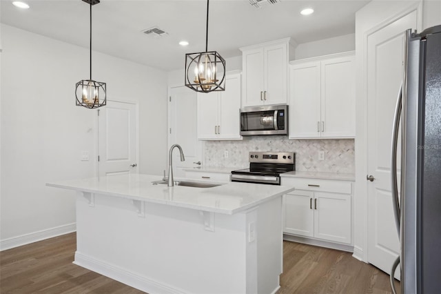 16484 Silver Brook Way, Winter Garden, FL 34787 - kitchen with stainless steel appliances, a sink, a chandelier, dark wood-style floors, and decorative backsplash