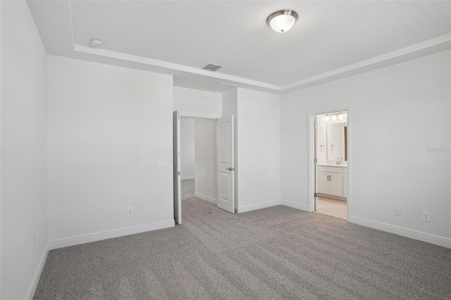 16484 Silver Brook Way, Winter Garden, FL 34787 - unfurnished bedroom with light colored carpet, baseboards, a sink, and ensuite bath