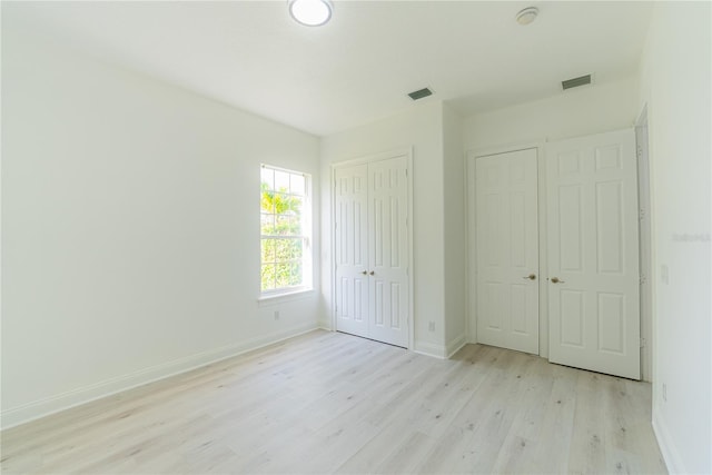 6550 Cartmel Ln, Windermere, FL 34786 - unfurnished bedroom featuring light wood-style floors, visible vents, and baseboards