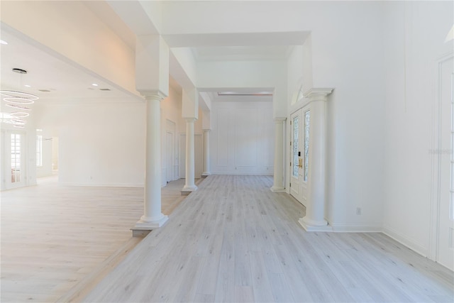 6550 Cartmel Ln, Windermere, FL 34786 - hall featuring light wood finished floors and decorative columns