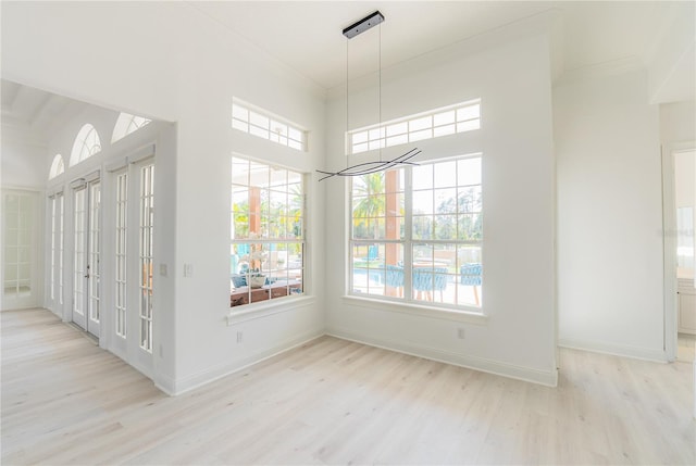 6550 Cartmel Ln, Windermere, FL 34786 - unfurnished dining area with plenty of natural light, wood finished floors, and ornamental molding