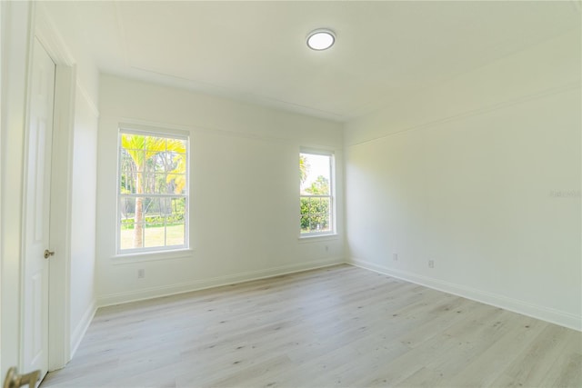 6550 Cartmel Ln, Windermere, FL 34786 - unfurnished room featuring a wealth of natural light, baseboards, and light wood-style floors
