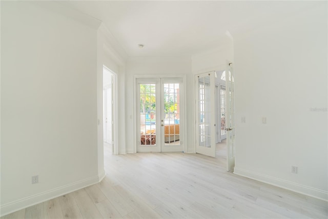 6550 Cartmel Ln, Windermere, FL 34786 - empty room featuring baseboards, french doors, and light wood-style flooring