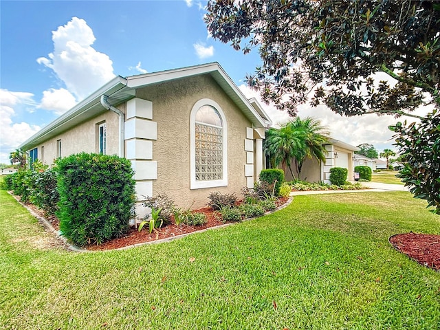 5060 NW 26th St, Ocala, FL 34482 - view of front of home featuring an attached garage, stucco siding, and a front lawn
