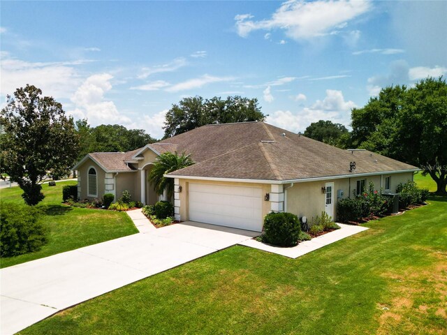 5060 NW 26th St, Ocala, FL 34482 - single story home with a garage, concrete driveway, a front lawn, stucco siding, and roof with shingles