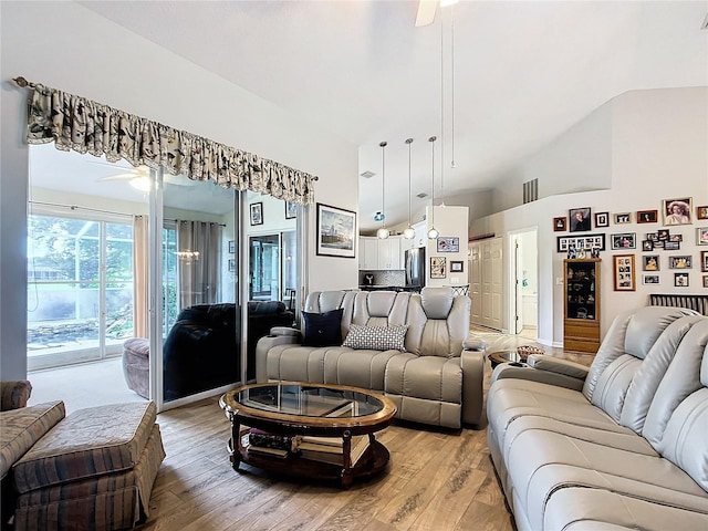 5060 NW 26th St, Ocala, FL 34482 - living room featuring light wood-type flooring, a towering ceiling, and a ceiling fan