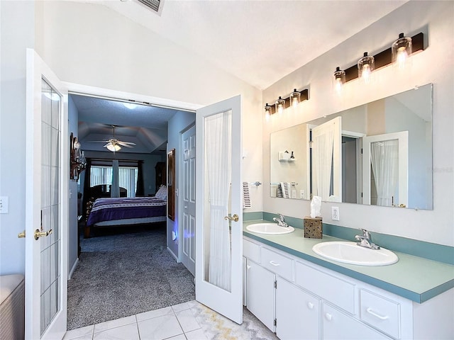 5060 NW 26th St, Ocala, FL 34482 - ensuite bathroom with french doors, a sink, and vaulted ceiling