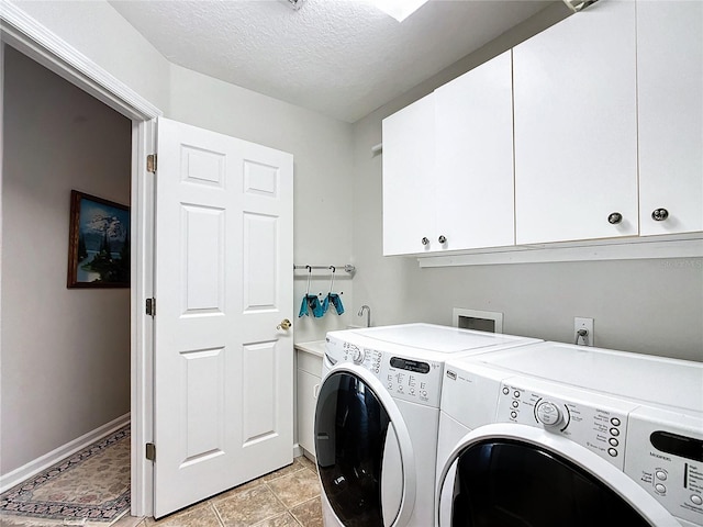 5060 NW 26th St, Ocala, FL 34482 - washroom with light tile patterned floors, baseboards, a textured ceiling, independent washer and dryer, and cabinet space
