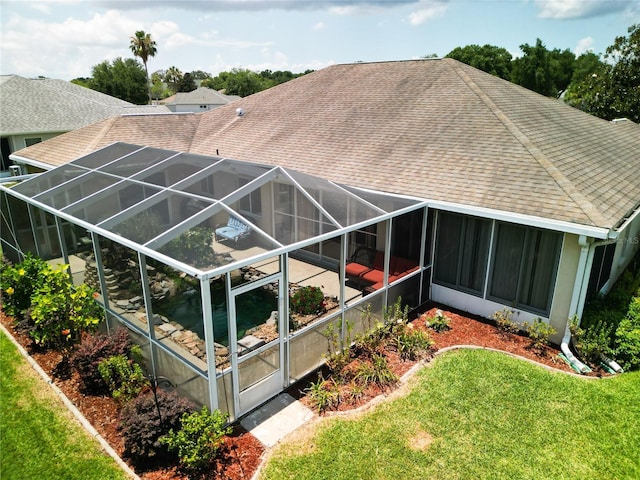 5060 NW 26th St, Ocala, FL 34482 - rear view of property featuring a lanai, roof with shingles, a yard, and a patio area