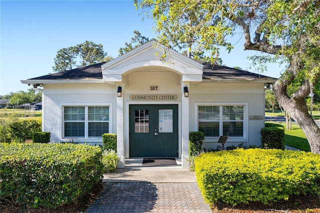 110 Tedworth Ct, Longwood, FL 32779 - entrance to property featuring stucco siding and roof with shingles