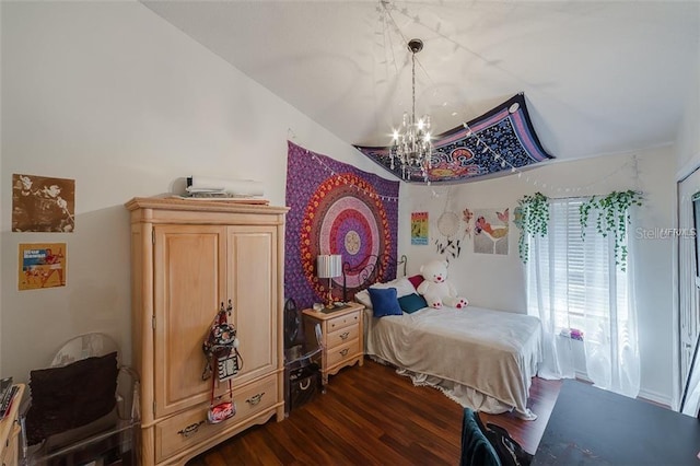 bedroom featuring a chandelier, dark wood finished floors, and vaulted ceiling