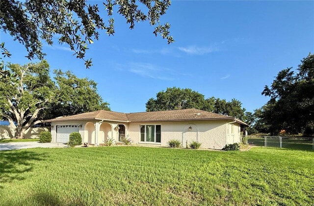 3652 Oak Grove Dr, Sarasota, FL 34243 - ranch-style house featuring an attached garage, stucco siding, and concrete driveway