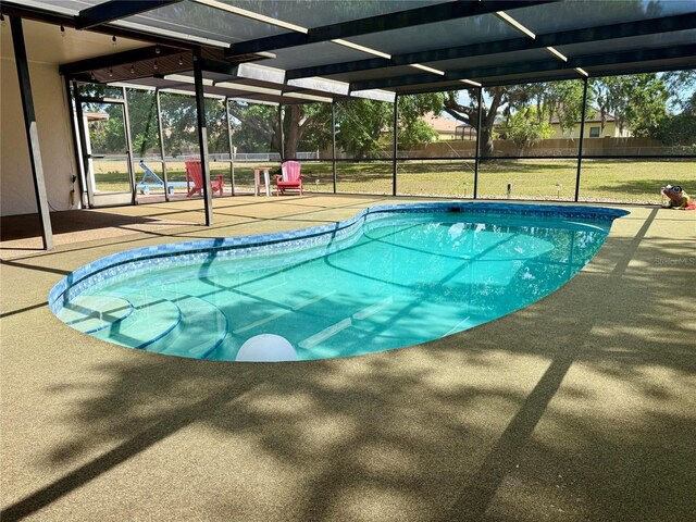 3652 Oak Grove Dr, Sarasota, FL 34243 - outdoor pool featuring a patio area and glass enclosure